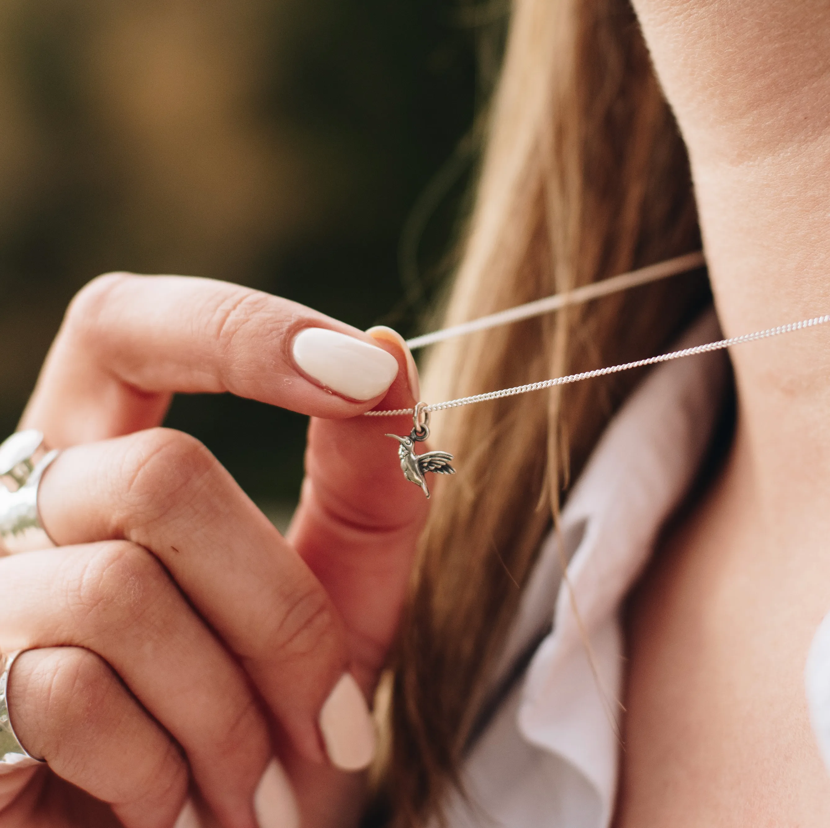 Tiny Hummingbird Charm Necklace in Silver